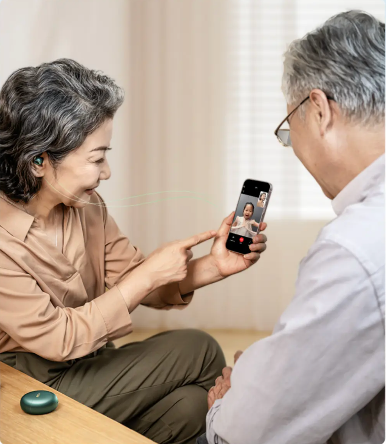 Two people using JIUYEE OTC hearing aids Bluetooth video calls. 